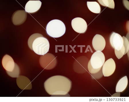 A blurry image of a red background with many white circles A blurry image of a red background with many white circles 130733921