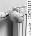 A radiator with a thermostat on it 130734125