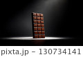 Chocolate bar is shown in a dark room 130734141
