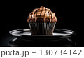 Chocolate cupcake with chocolate drizzle on top 130734142