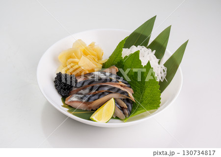 Delicate shime-saba mackerel adorned with glossy black caviar 130734817