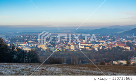 Aerial view of Moravska Trebova with its scenic panorama. The town is surrounded by rolling hills and dense forests, showcasing the harmony of historic architecture and Czech nature 130735669