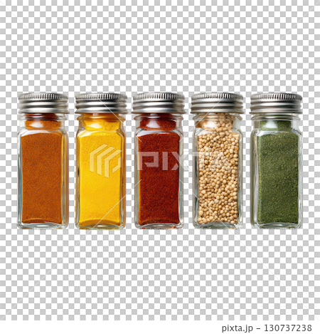 Colorful Assortment of Spices in Clear Glass Containers on a White Background for Culinary Inspiration 130737238