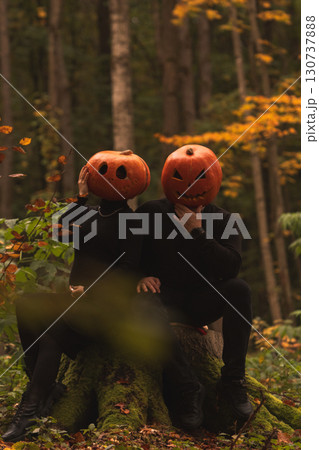 Halloween Pumpkin Heads in Autumn Forest Halloween Pumpkin Heads in Autumn Forest 130737888