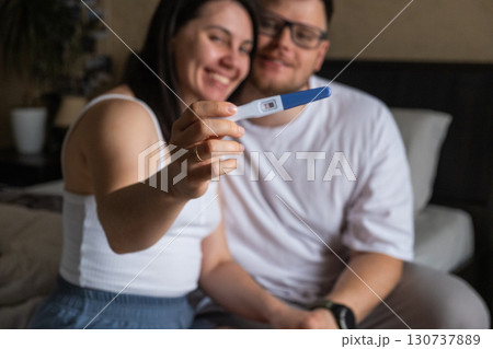 Happy Couple Celebrating Positive Pregnancy Test Happy Couple Celebrating Positive Pregnancy Test 130737889