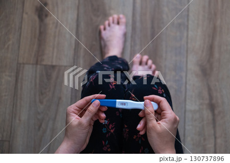 Positive Pregnancy Test in Hand 130737896