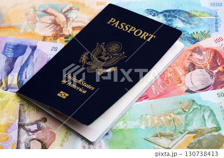 American passport on Maldivian money 130738413