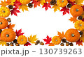 Hanging Garland of many maple leaves, white and yellow pumpkins, acorns, ears of wheat on a white plain background. Decoration for Halloween or Thanksgiving. 130739263