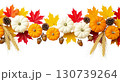 Hanging Garland of many maple leaves, white and yellow pumpkins, acorns, ears of wheat on a white plain background. Decoration for Halloween or Thanksgiving. 130739264