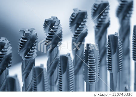 The groups of CNC machine tapping tool in the blue tone scene. 130740336