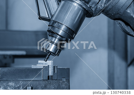 The chamfer milling process on NC milling machine with chamfer tools in the light blue scene. 130740338