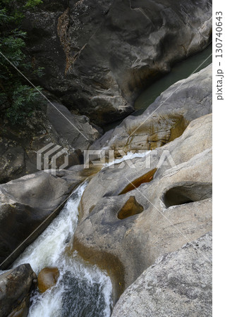 Huge rocks in a mountain river in a tropical forest in Vietnam Huge rocks in a mountain river in a tropical forest in Vietnam 130740643