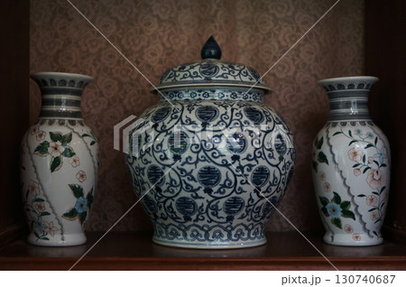 Elegant ceramic vases showcasing intricate floral patterns and designs Elegant ceramic vases showcasing intricate floral patterns and designs 130740687