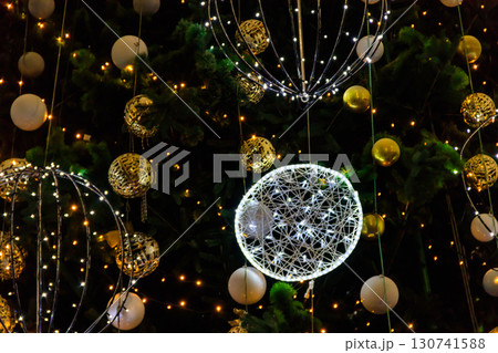 Detail of decorated christmas tree with xmas lights Detail of decorated christmas tree with xmas lights 130741588
