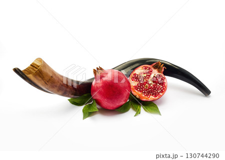 Pomegranate and Shofar. Rosh Hashanah Symbols. Jewish New Year celebration. Pomegranate and Shofar. Rosh Hashanah Symbols. Jewish New Year celebration. 130744290