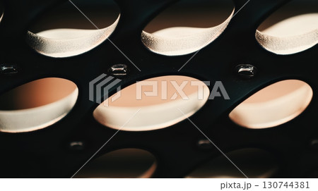 Close-up of a textured surface highlighting light and shadow patterns Close-up of a textured surface highlighting light and shadow patterns 130744381