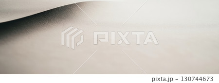 Soft curves of white paper create a serene and minimalistic aesthetic Soft curves of white paper create a serene and minimalistic aesthetic 130744673