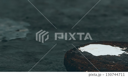 Rusty metal surface with white paint on a rainy day in an urban setting 130744711