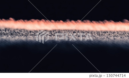 Intricate patterns of sand and light at sunset near the shore 130744714