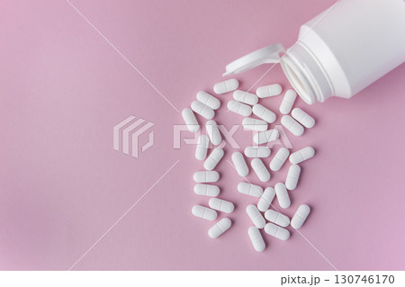 Medical pills and drugs in white package on the pink background. Healthcare concept. Space for text. 130746170