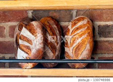 Baked loafs at the show shelf of a bakery 130746986