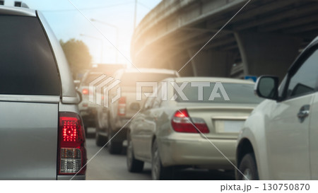 Rear side of pickup car grey color with turn on brake light. Traffic jam in the city. Many cars stop on the road curves under the overpass. with light from front. Rear side of pickup car grey color with turn on brake light. Traffic jam in the city. Many cars stop on the road curves under the overpass. with light from front. 130750870
