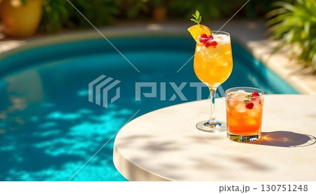 Two Pimm's Cup cocktails on a table beside a swimming pool at a vibrant summer pool party Two Pimm's Cup cocktails on a table beside a swimming pool at a vibrant summer pool party 130751248