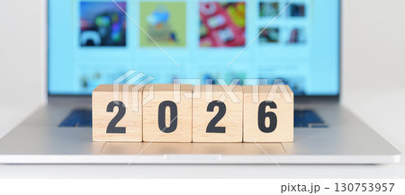 2025 end year to Happy New Year 2026 block against laptop background. Hiring, recruitment, job, Social Media, SEO, Search Engine Optimization and New Year concepts 130753957