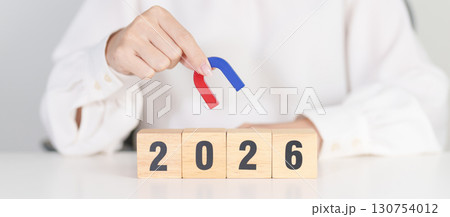 hand holding magnet over 2026 Year block. Human resource management, Recruitment, Teamwork, strategy, toxic people and leadership Concepts 130754012