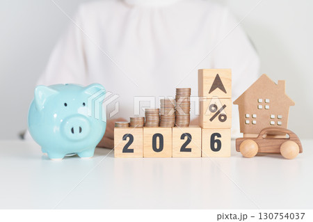 2026 New Year with percentage change to UP and Down arrow, car and Home model with coin stack. Car loan, Interest rate, real estate, house, Insurance, Financial, Repair, Tax, mortgage and Maintenance 130754037