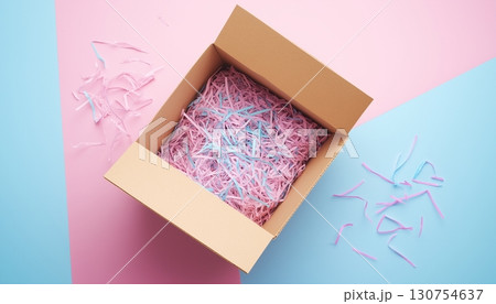 Cardboard box with shredded paper safety fragile product delivery shipment 130754637