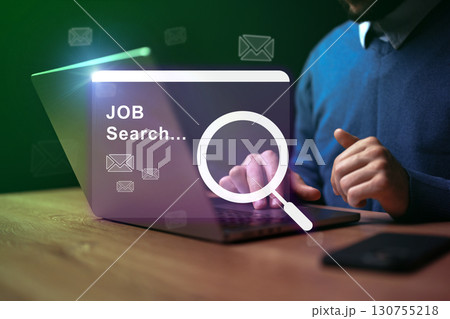 Job seeker engaged in online search for employment opportunities on a laptop 130755218