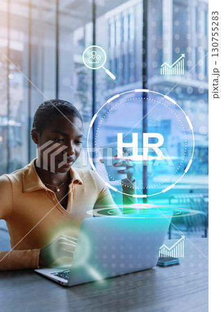 Professional woman engaging in HR work with a laptop in a modern office environment during the day Professional woman engaging in HR work with a laptop in a modern office environment during the day 130755283