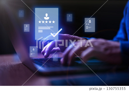 User engaging with digital documents on a laptop with glowing icons in a modern workspace environment User engaging with digital documents on a laptop with glowing icons in a modern workspace environment 130755355
