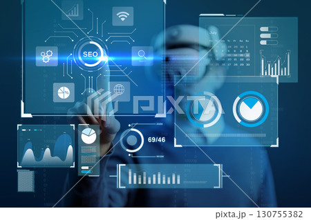 Professional analyzing SEO data in a digital workspace using virtual reality technology Professional analyzing SEO data in a digital workspace using virtual reality technology 130755382