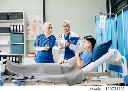 Hospital Ward  Female Professional Asian Doctors Talk with a Patient, Give Health Care Advice, Recommend Treatment Plan 130755395