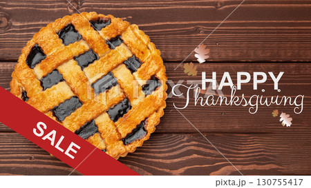 Thanksgiving pie sale features a delicious blackberry pie with a festive background 130755417