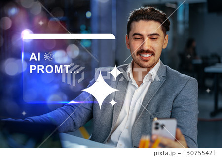 Professional man interacting with smartphone while engaged in a modern office setting during evening hours Professional man interacting with smartphone while engaged in a modern office setting during evening hours 130755421