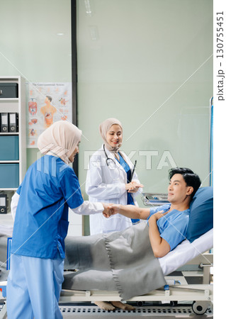 Hospital Ward  Female Professional Asian Doctors Talk with a Patient, Give Health Care Advice, Recommend Treatment Plan 130755451