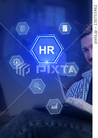 Man engaged in human resources activities with digital interface elements in a modern office setting 130755462