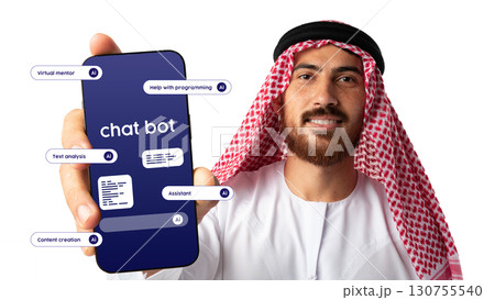 Man in traditional attire displays smartphone showcasing chatbot features for programming assistance and content creation 130755540