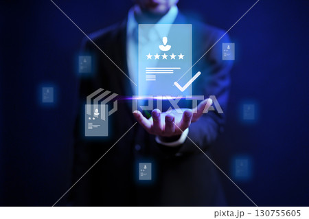 Professional man showcasing digital credentials and reviews in a modern setting with a technology focus 130755605