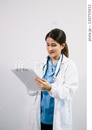 Muslim Arab person. The face of a female doctor on an isolated white background. Muslim Arab person. The face of a female doctor on an isolated white background. 130755652