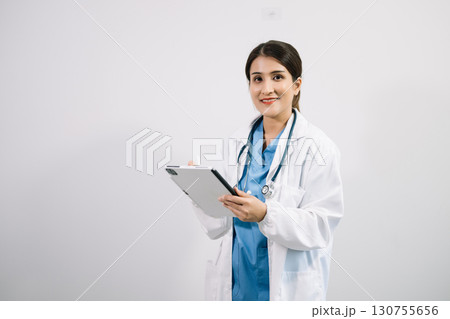 Muslim Arab person. The face of a female doctor on an isolated white background. 130755656