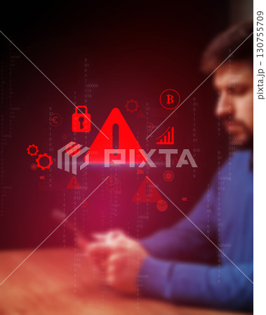 Individual analyzing digital security risks while using smartphone in low-lit environment with warning symbols present Individual analyzing digital security risks while using smartphone in low-lit environment with warning symbols present 130755709