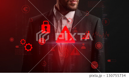 Business professional in a suit assessing cybersecurity threats with digital icons in a dark environment during a modern presentation Business professional in a suit assessing cybersecurity threats with digital icons in a dark environment during a modern presentation 130755734