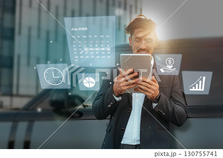 Business professional using tablet to access digital tools outdoors in an urban environment during the day in July 2025 Business professional using tablet to access digital tools outdoors in an urban environment during the day in July 2025 130755741