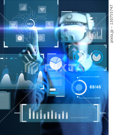 Exploring virtual technology with data analytics and SEO insights in a futuristic workspace 130755747