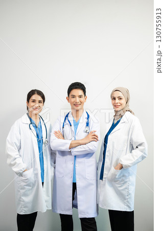 Successful team of medical doctors looking at camera and smiling while standin. Health, professional and people team 130755913