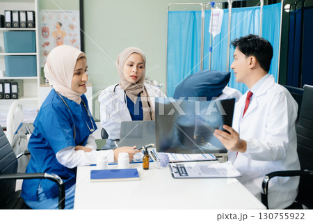 Medical, meeting and laptop for team in discussion, brainstorming and planning. Doctor, nurse on desk 130755922